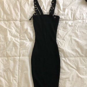 Black fitted dress with buckle straps